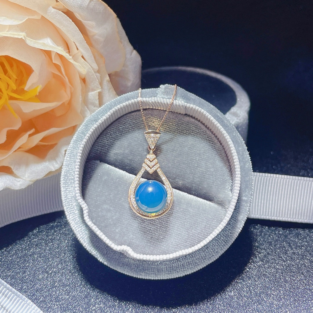 Novedad exclusiva: joyería con colgante de ámbar azul dominicano incrustado en oro de 18 quilates