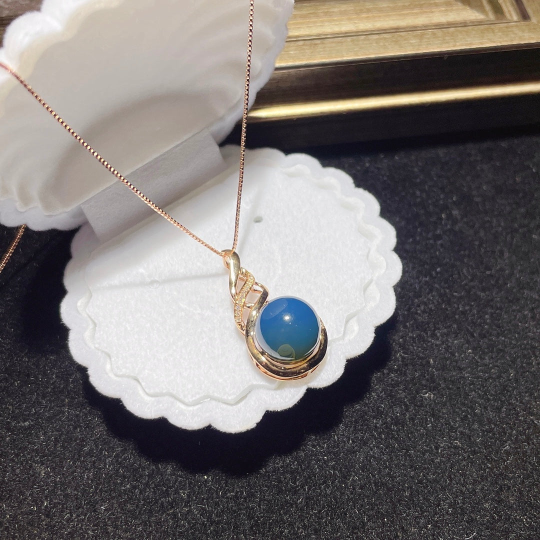 Colgante de Ámbar Azul Dominicana Incrustado en Oro de 18K - Joyería Exquisita