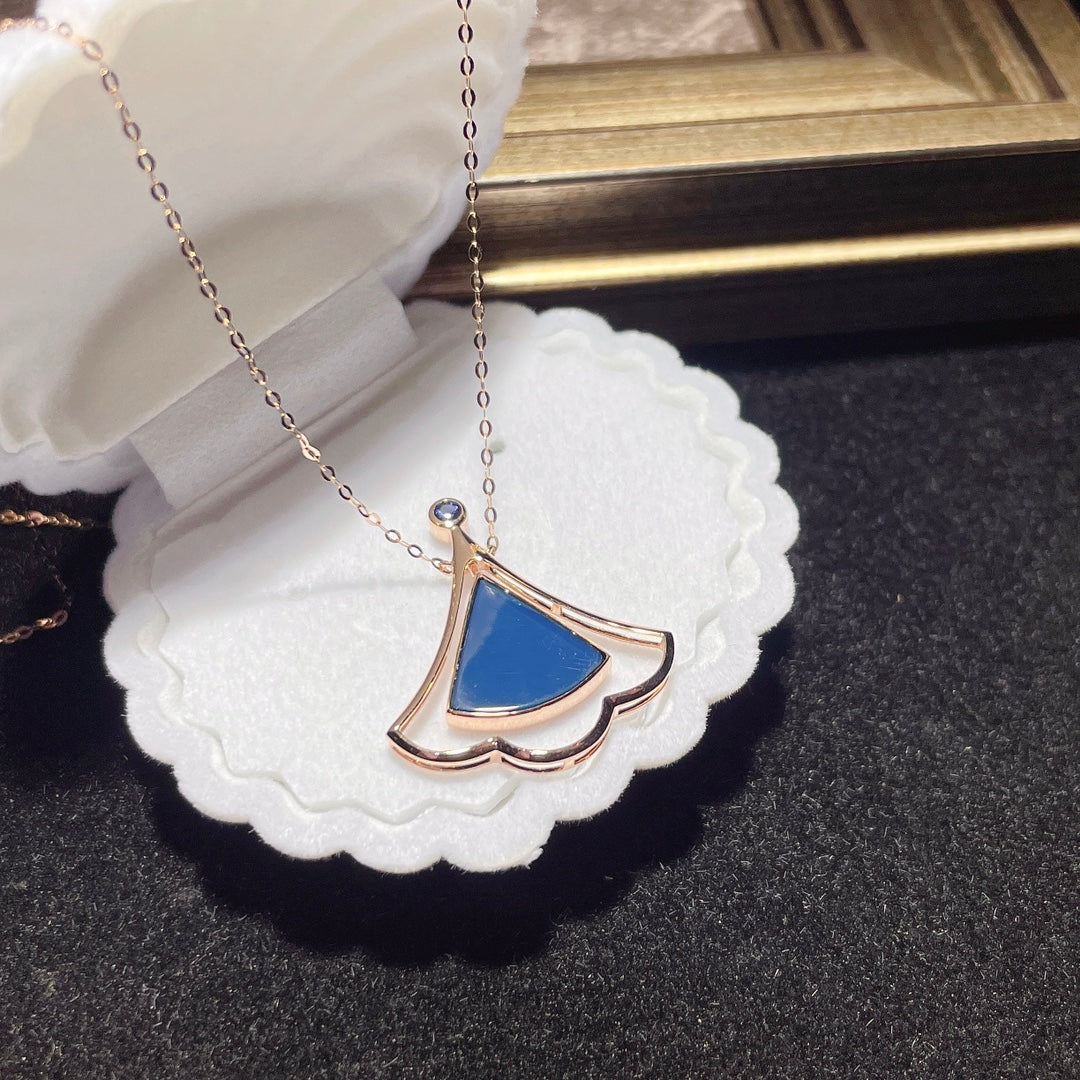 Exclusivo de joyería: colgante de ámbar azul dominicano incrustado en oro de 18 quilates