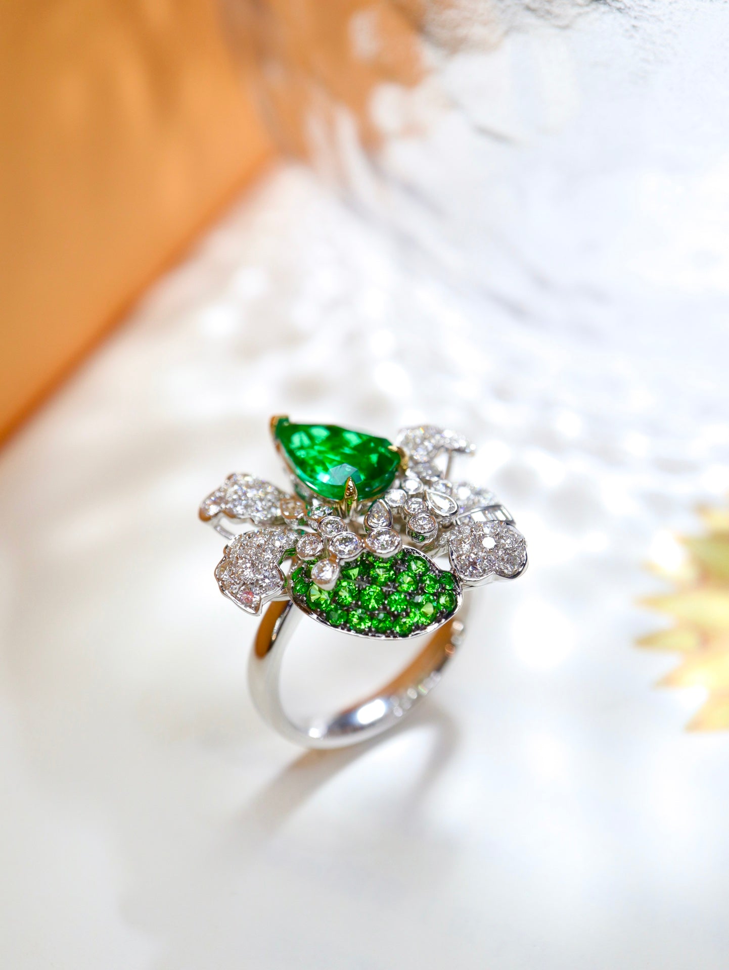 Emerald Flower Jewelry Design with Sparkling Diamonds