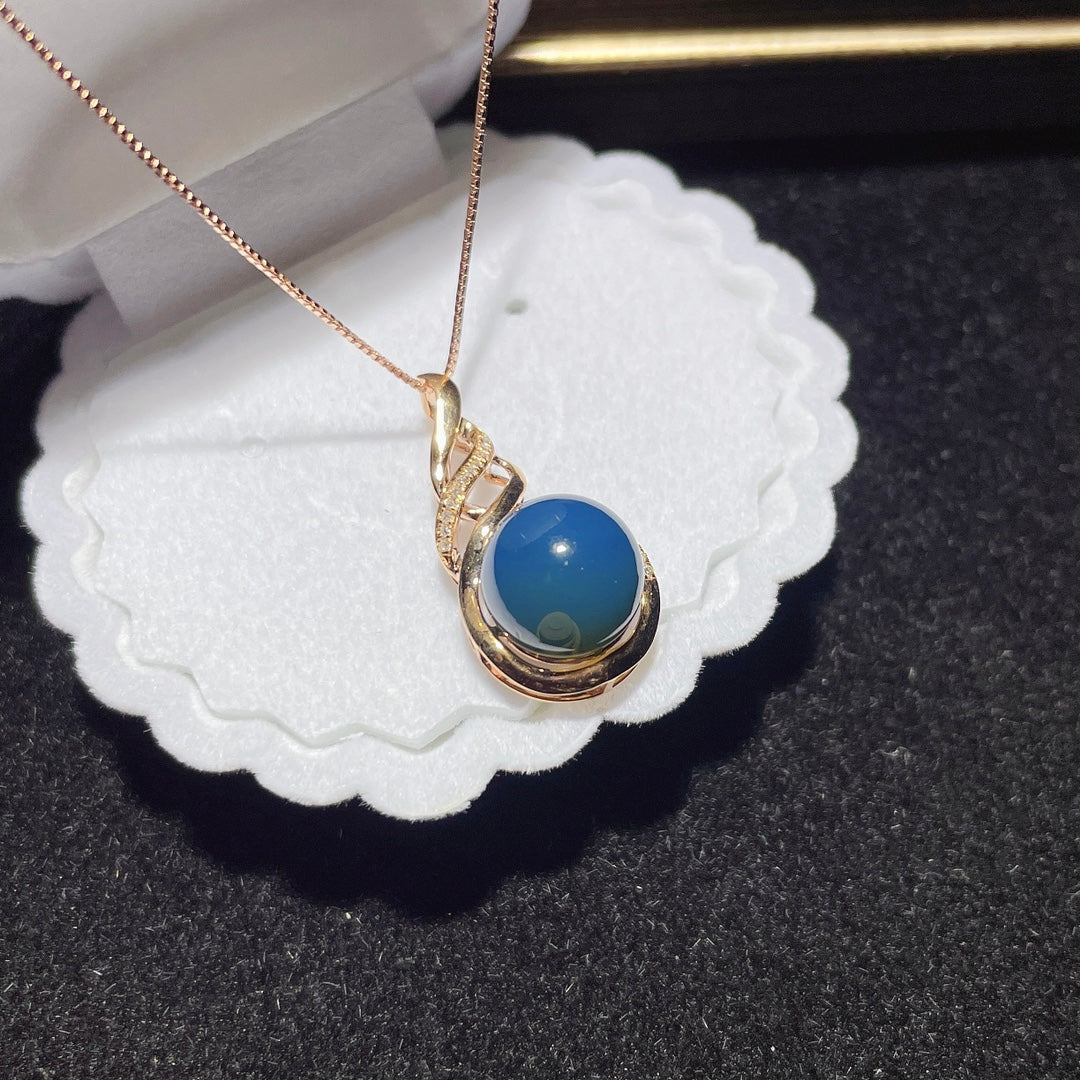 Colgante de Ámbar Azul Dominicana Incrustado en Oro de 18K - Joyería Exquisita